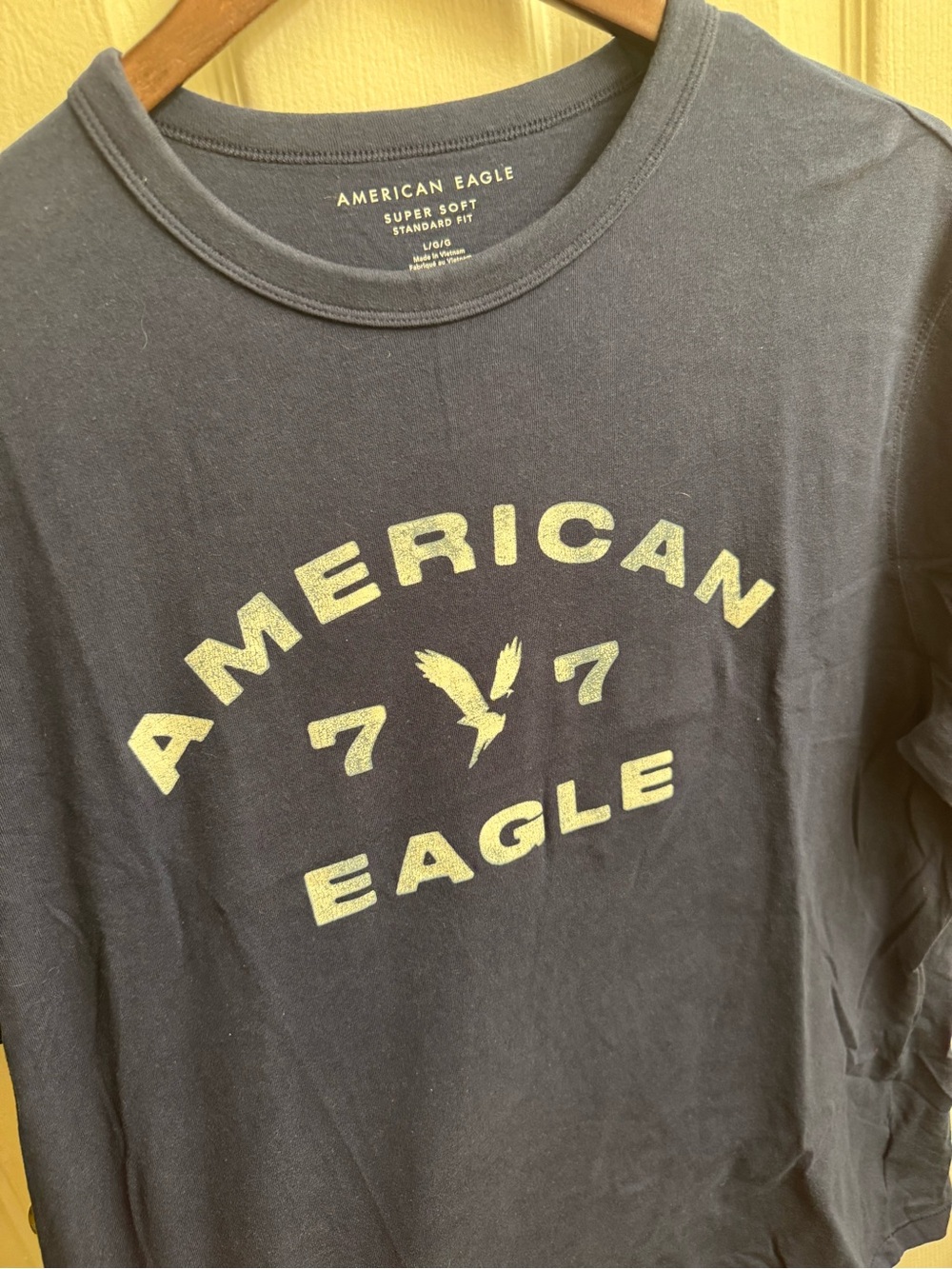 American Eagle Outfitters Navy Super Soft Tee with Pale Yellow Logo